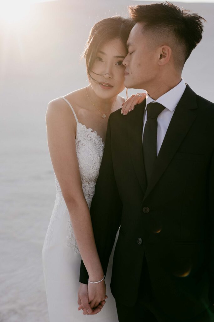Close-up of a couple in soft golden light at Lancelin Sand Dunes—capturing the romance of Western Australia pre-wedding photo locations.
