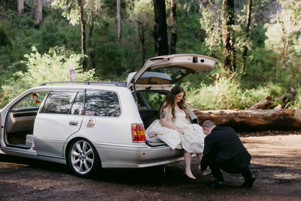 bride and groom in car getting ready to go on their adventure into the boranup forrest for the pre-wedding shoot in perth boranup forrest