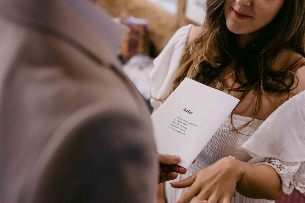 reading voews to each other at the ceremony for the micro-wedding