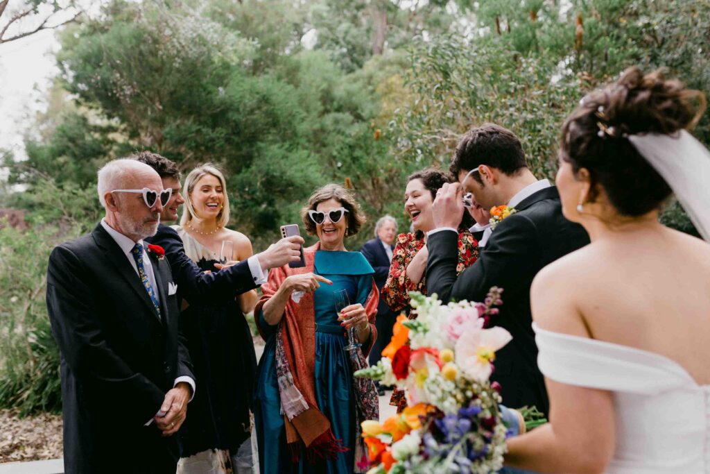 guests laughing after micrp-wedding ceremony in marlee pavillion