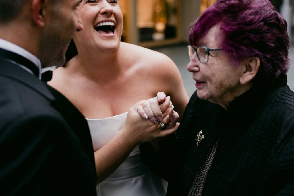 Couple sharing an emotional moment with family at their intimate Perth wedding]