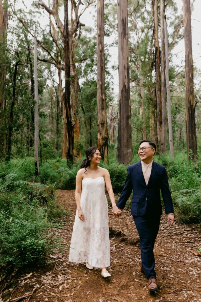 couple roaming through the boranup forrest during their Perth pre-wedding photoshoot.