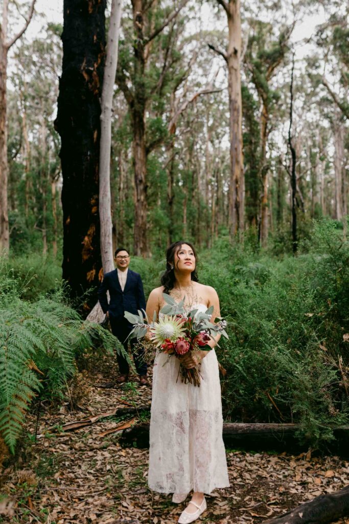 Playful couple laughing during their Boranup Forest photoshoot