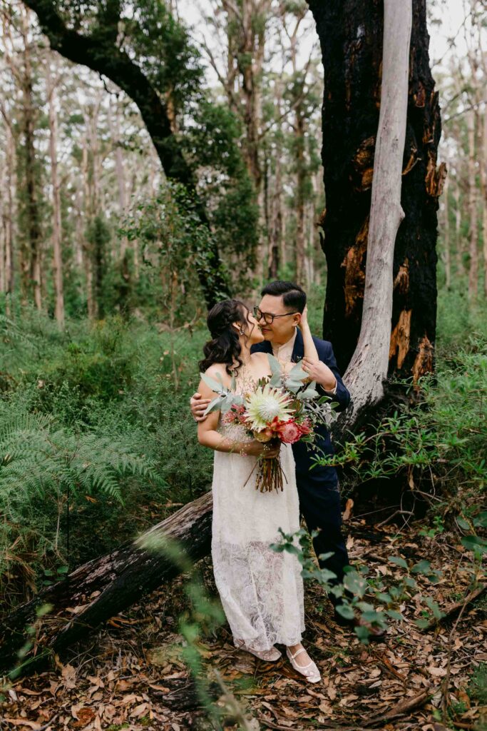 Playful couple laughing during their Boranup Forest photoshoot