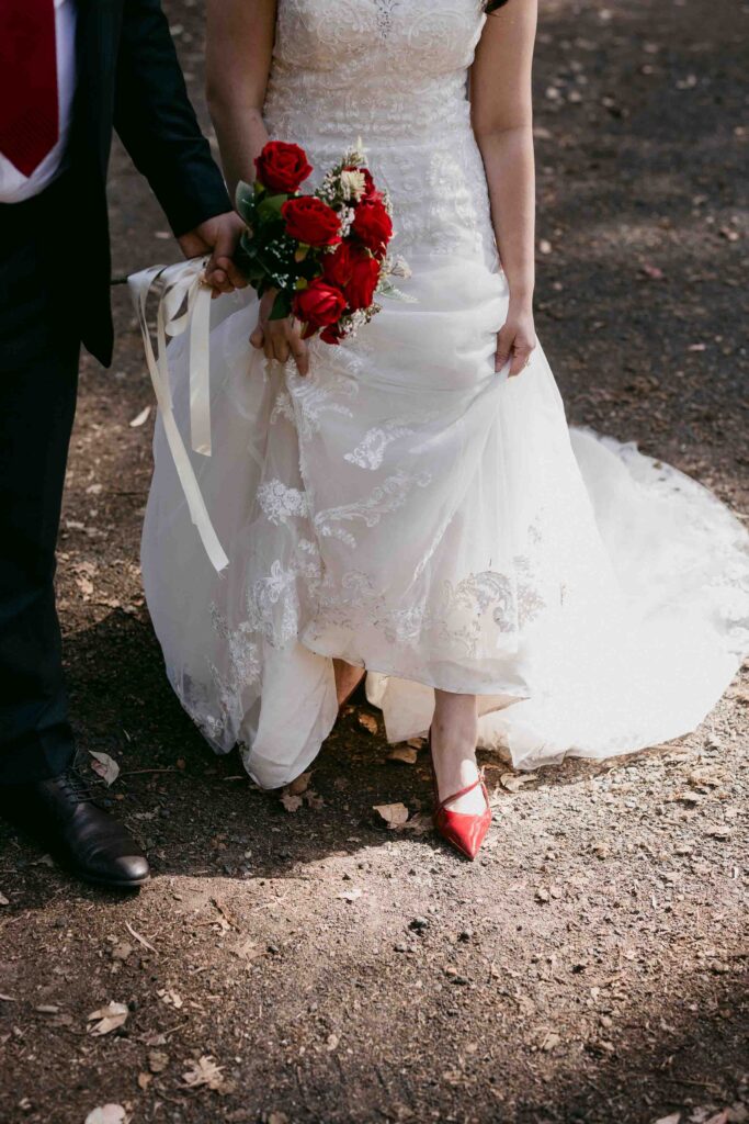 Cadence’s red shoes and wedding dress during her Boranup Forest shoot
