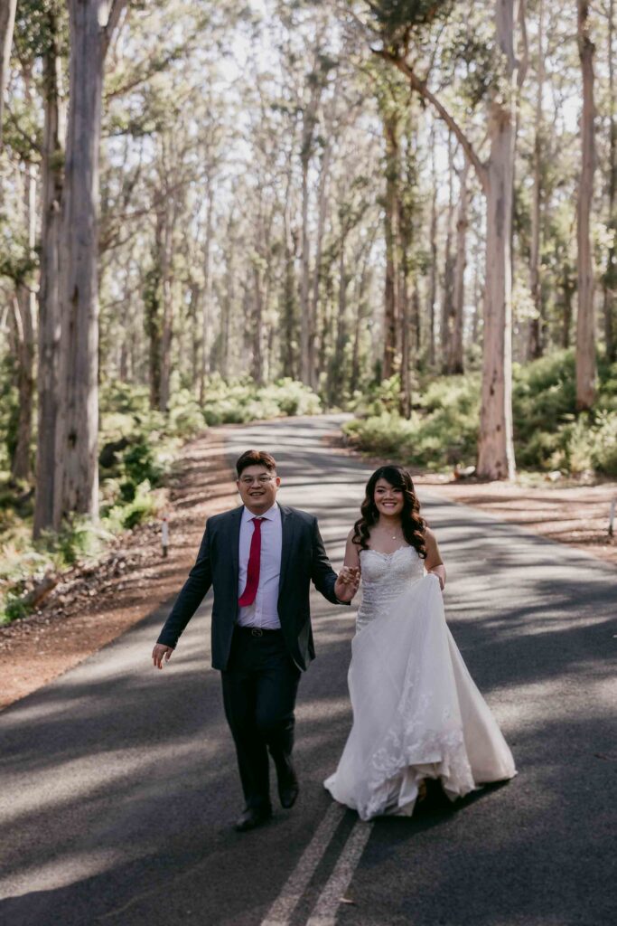 Cadence smiling as Nicholas guides her through a dance in Boranup Forest
