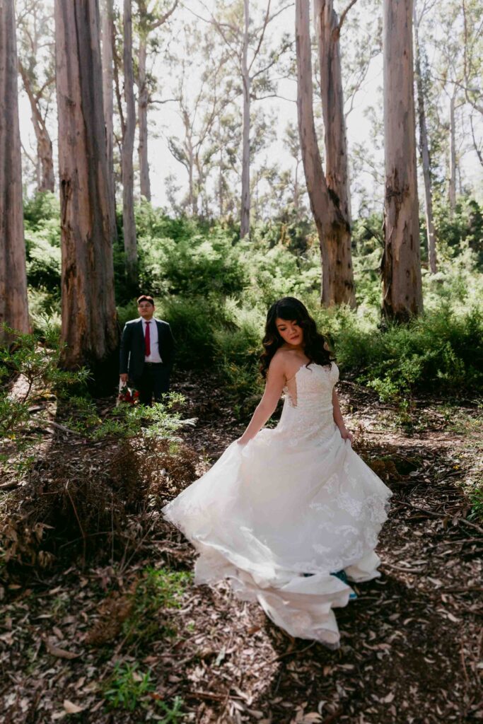 Cadence twirling her dress while Nicholas watches in Boranup Forest