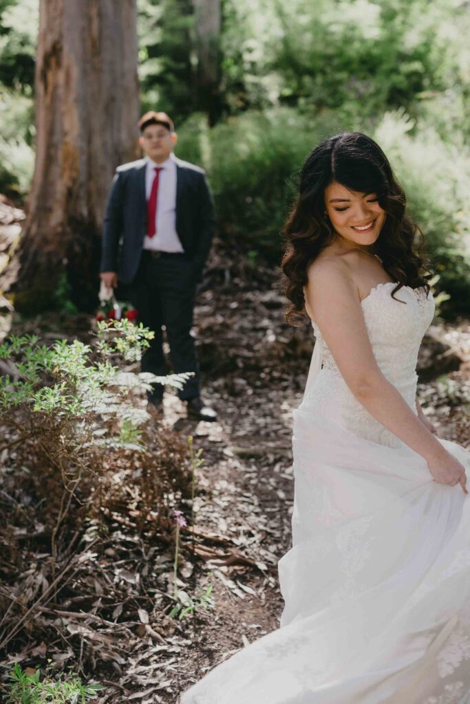 Cadence twirling her dress while Nicholas watches in Boranup Forest
