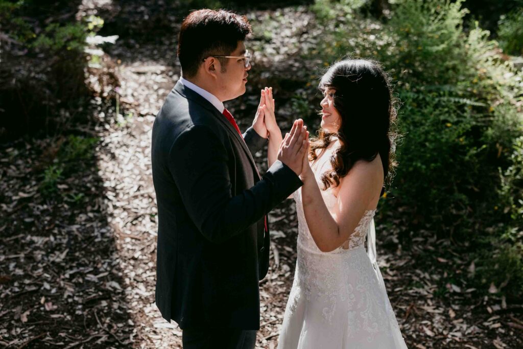 Cadence and Nicholas holding hands during their Boranup Forest session