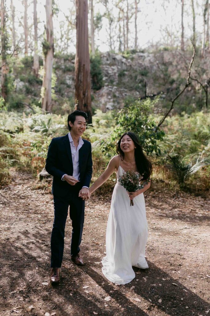 Kenneth and Flora walking together during their Boranup Forest pre-wedding shoot