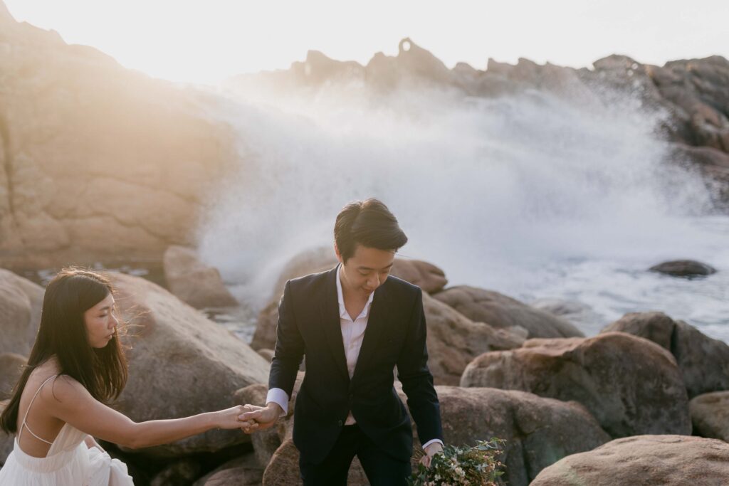 waves cashing in the background at INjidup spa for their pre-wedding photos