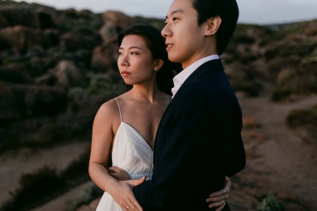 couple enjoying their sunset view for thei pre-wedding photos