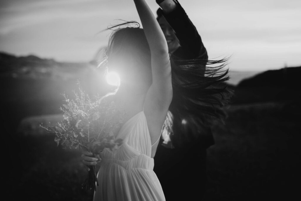 couple dancing in blue hour in black and white photo for their pre-wedding images