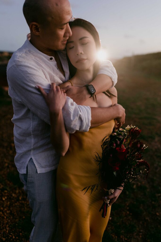 couple embraxing at INjidup spa yallingup