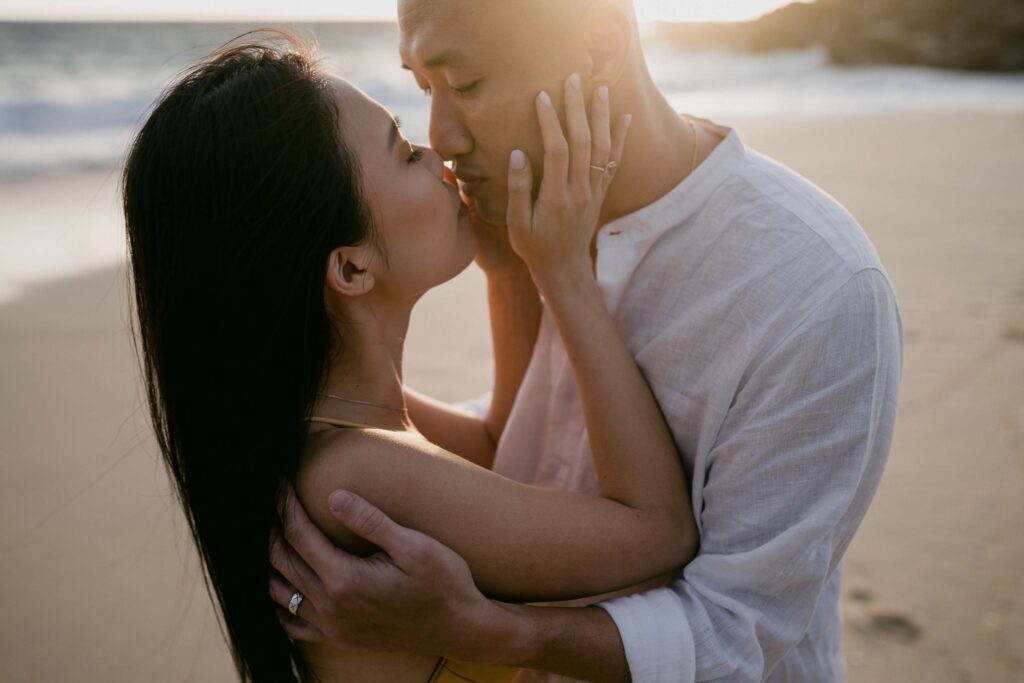 couple kissing at Yallingup injidup spa pre-wedding session Margaret River