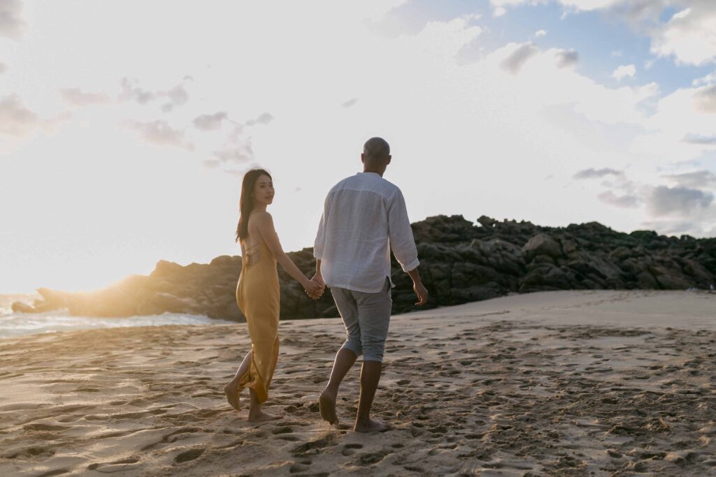 couiple walking at sunsit on the beach in Yallingup