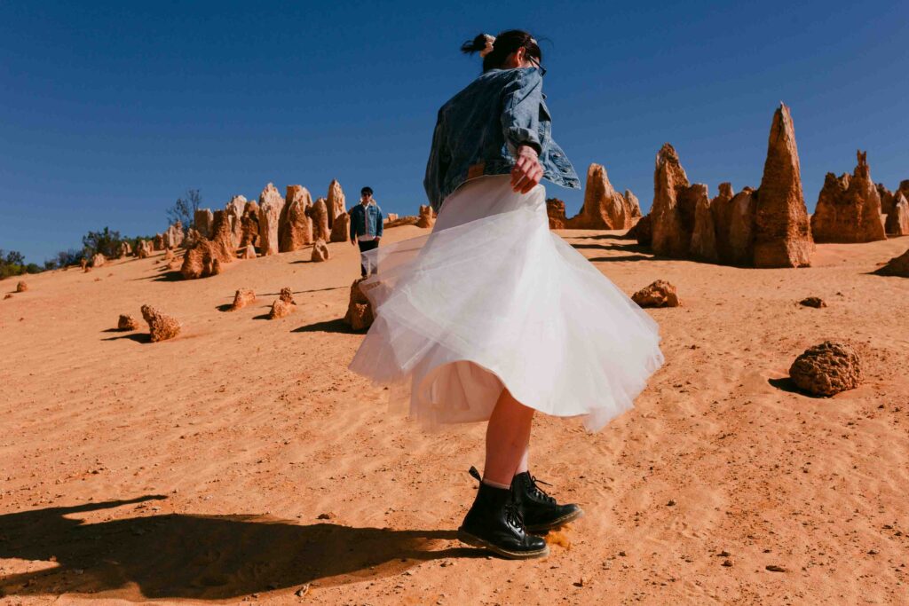 Rachel twirling for the camera during their Pinnacles pre-wedding photography session
