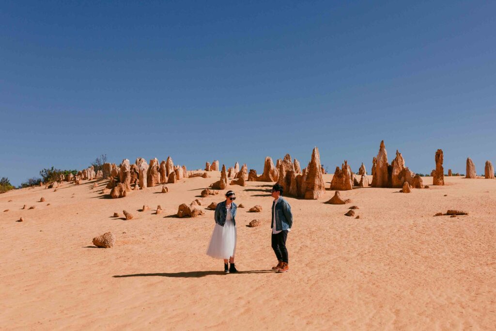 Marco and Rachel wearing denim jackets and sunglasses during their Pinnacles pre-wedding photography session