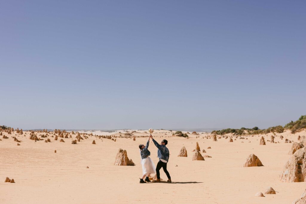 Having fun at their pre-wedding shoot in the Pinnacles Numbung
