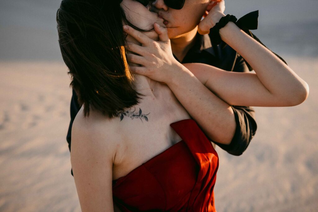 Marco and Rachel sharing an intimate kiss at the Lancelin Sand Dunes
