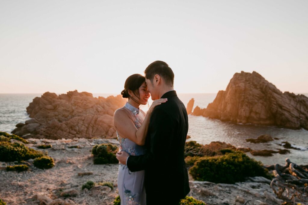 sunset with couple in forgroad at sugarloaf rock for their pre wedding photos