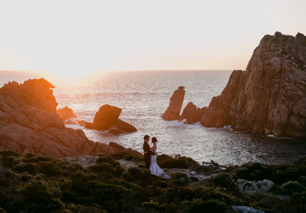 sunset with couple in forgroad at sugarloaf rock for their pre wedding photos