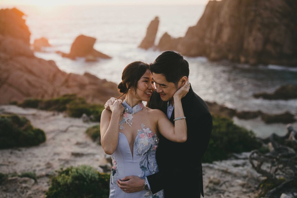 Couple photographed along the Sugarloaf Rock coastline before sunset