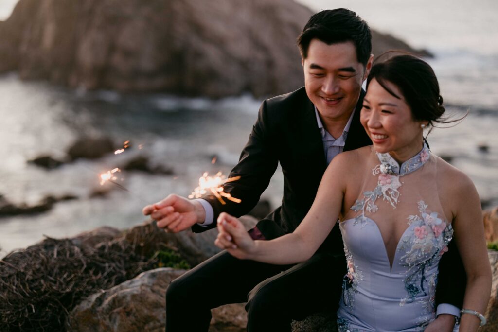 Alex and Bridget creating sparkler photographs after sunset at Sugarloaf Rock