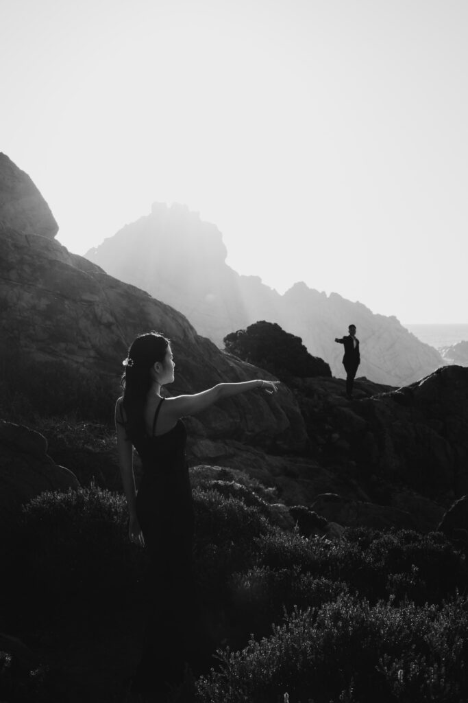 Black and white portrait of Joey and Davis surrounded by the rugged South West coastline