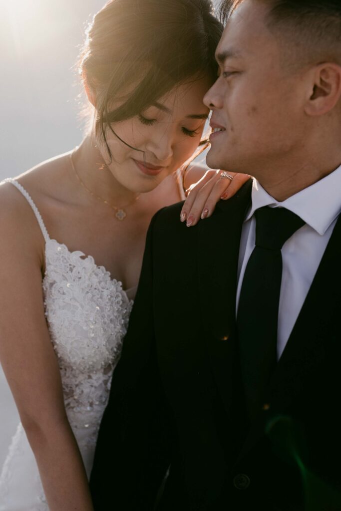 Davis kissing Joey’s forehead during their intimate Lancelin pre-wedding shoot