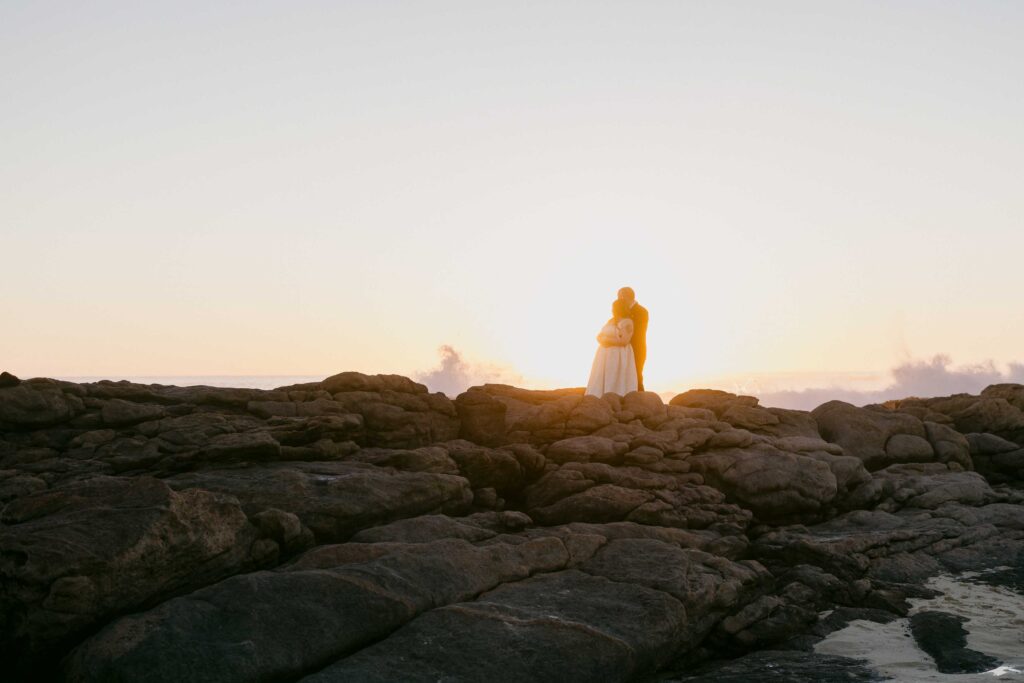Newlyweds watching the sunset along the Margaret River coastline