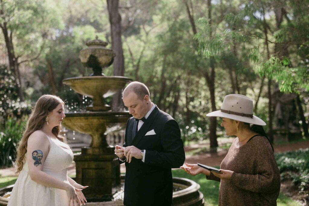 Megan and Jake ring exchange husband and wife at La Forêt