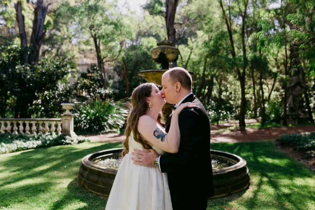 Megan and Jake sharing their first kiss as husband and wife at La Forêt