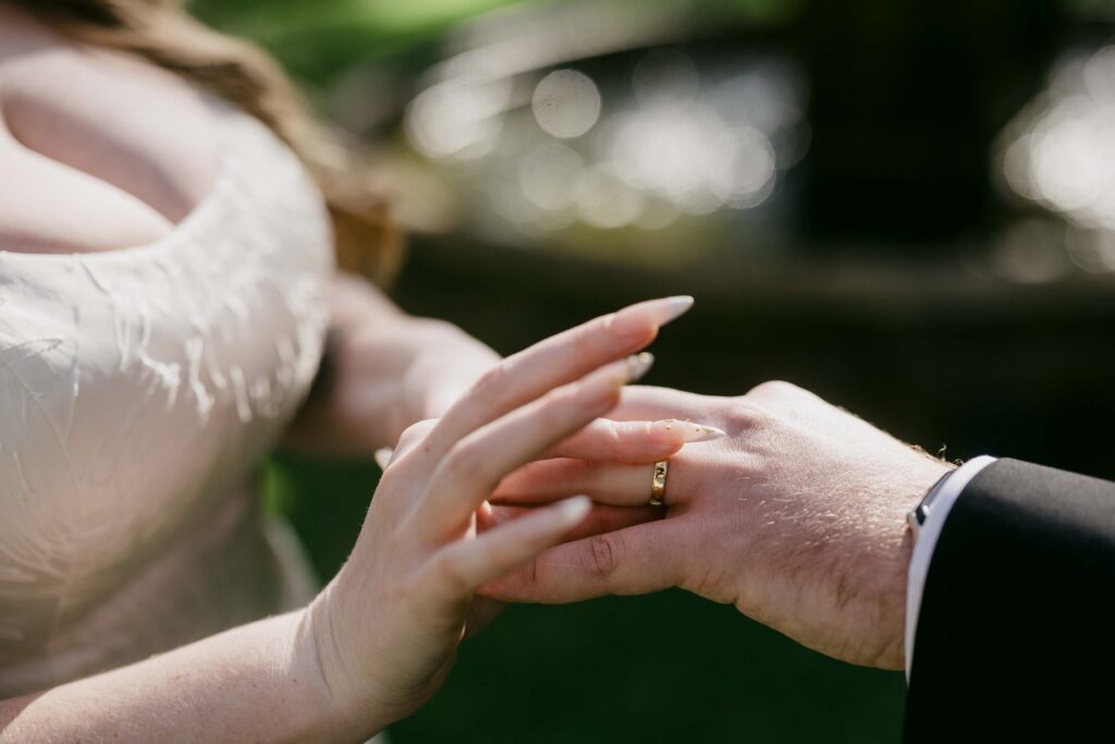Megan and Jake exchanging rings during their Margaret River elopement