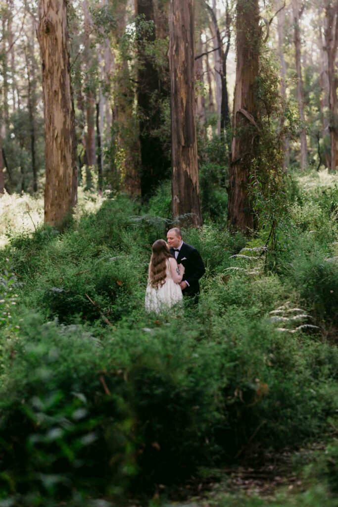 Couple privately exchanging personal vows during a Boranup Forest elopement