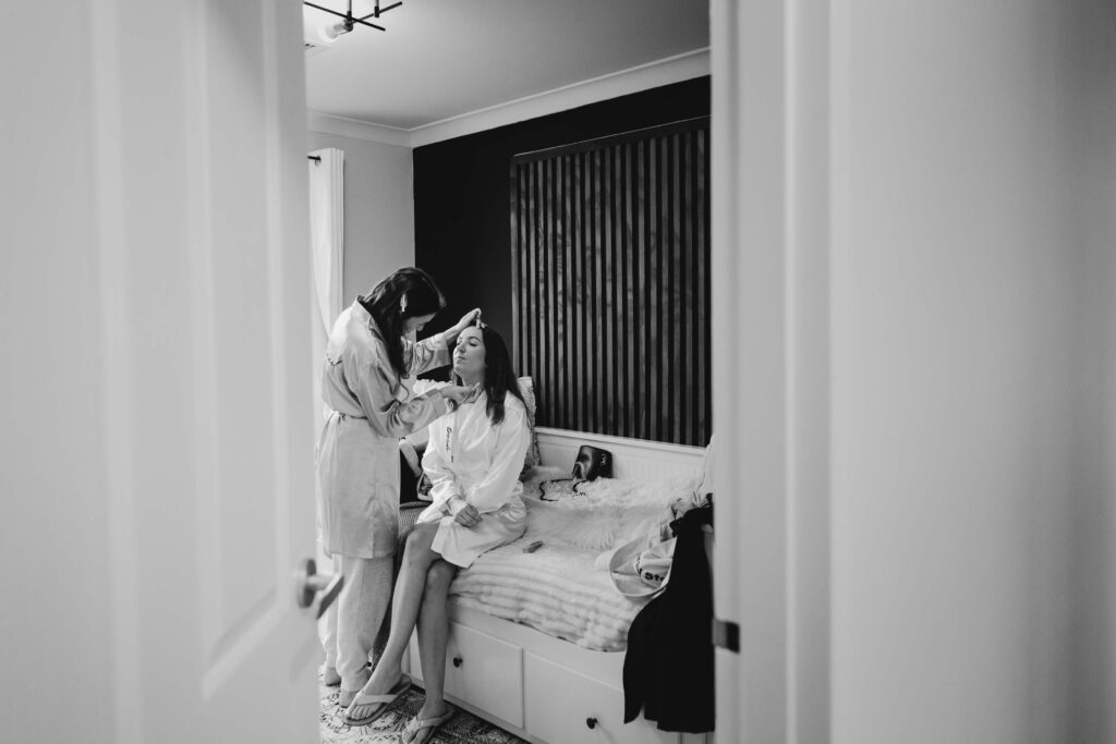 bride getting ready with make up artist