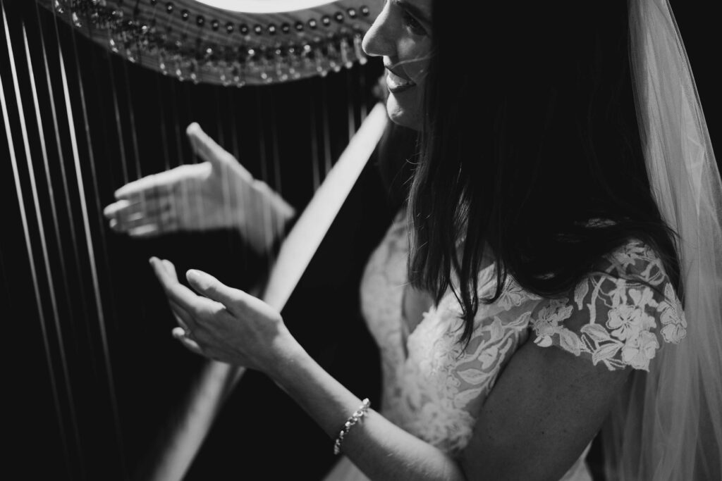 Bride photographed beside a harp inside St Paul’s Anglican Church