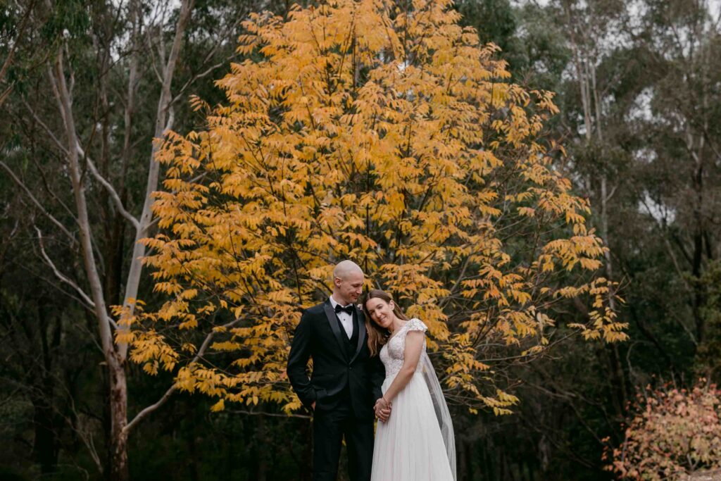 Bride and groom surrounded by autumn colours during their Jarrahdale micro wedding