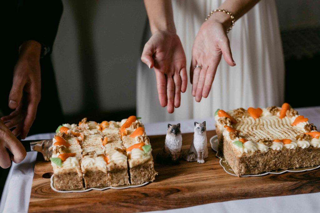 Wedding cake with custom cat toppers representing Tilly and Penny