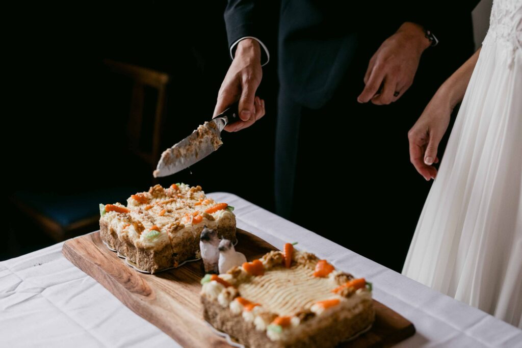 Couple cutting their wedding cake after their St Paul’s Church ceremony