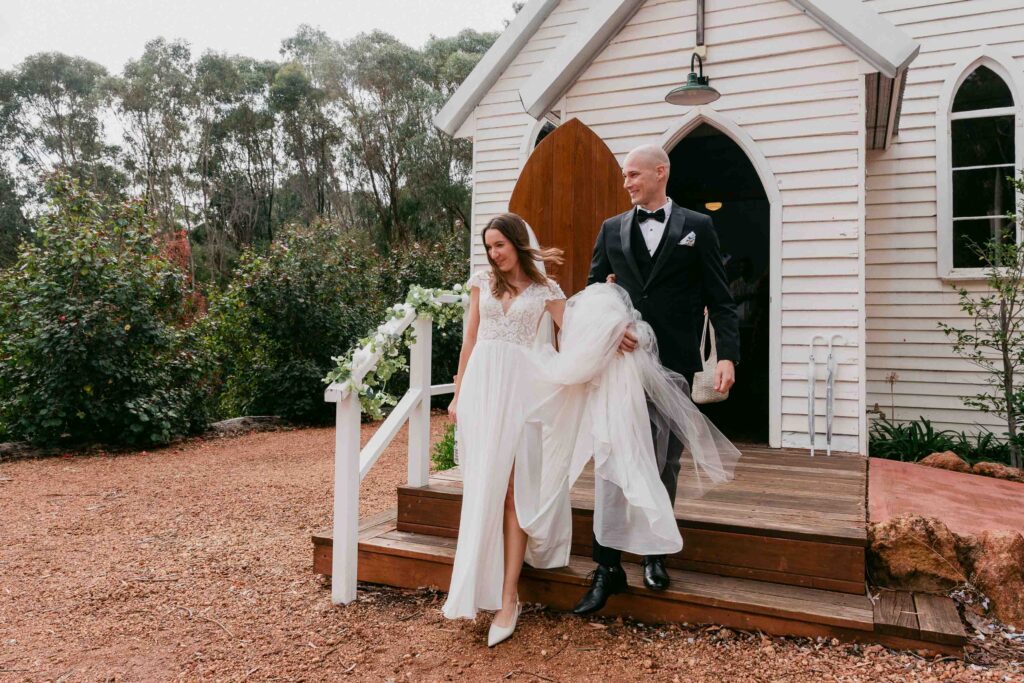 Bride and groom outside historic St Paul’s Anglican Church Jarrahdale