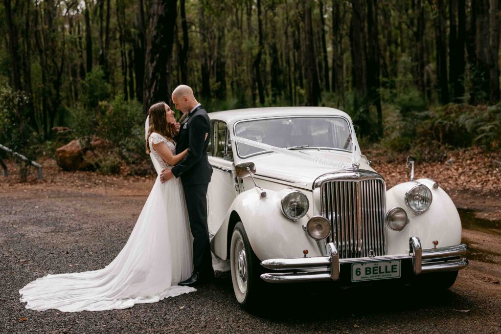 Newlyweds with a vintage Jaguar limousine at Langford Park Jarrahdale