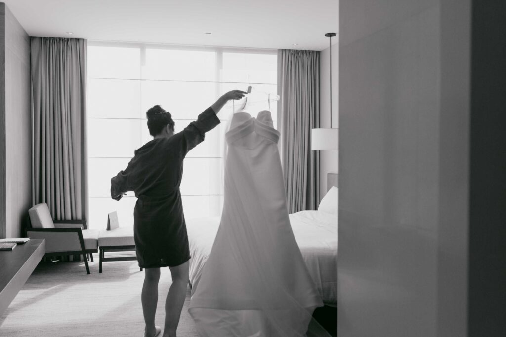 Bride carrying dress ready to get fitted