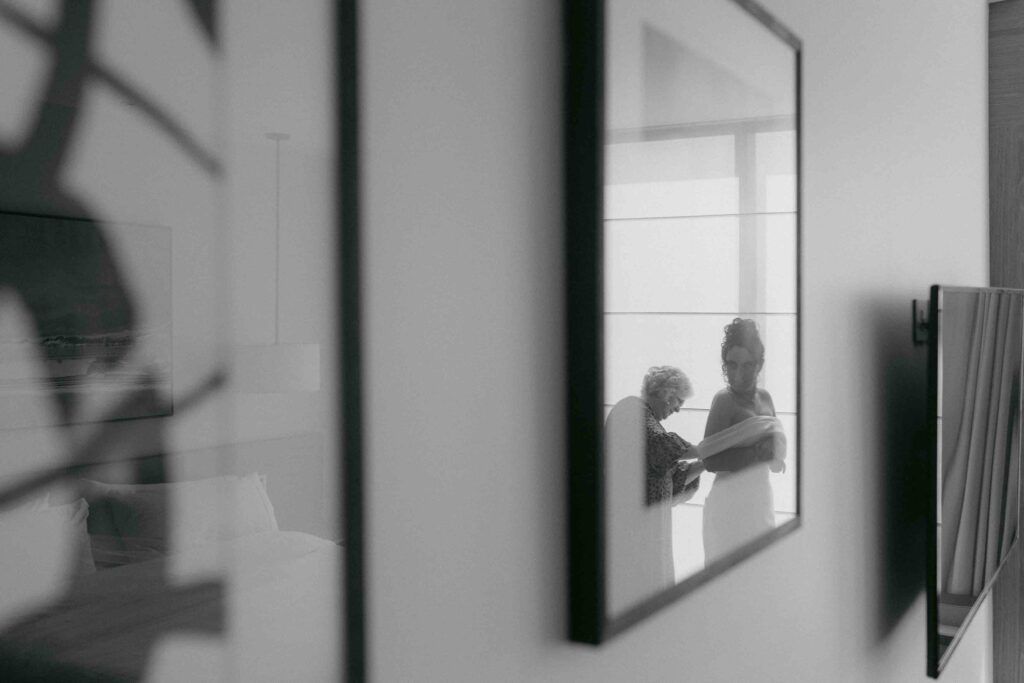 Bride fitting into dress at the Westin Perth