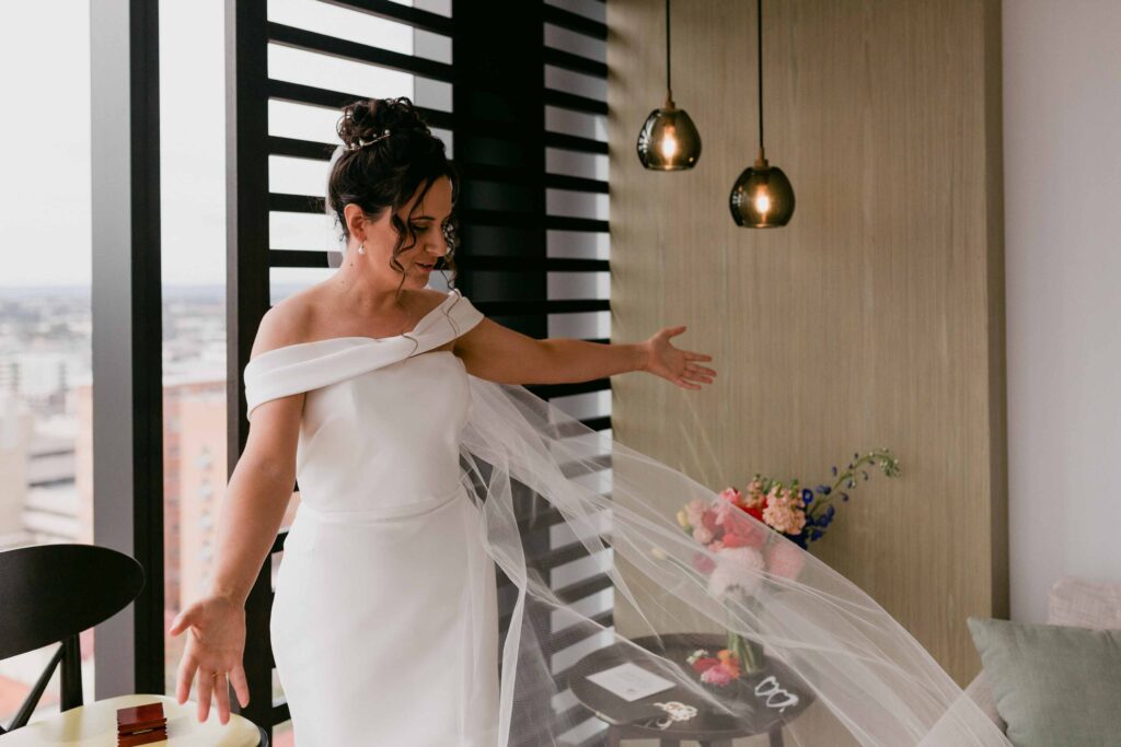 Bride fitting into dress at the Westin Perth