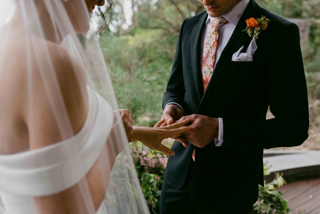 exchange rings at ceremony in marlee pavillon in Kings park